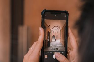 person holding black iphone 5